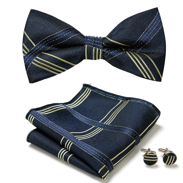 Trendy heren vlinderstrikset met modern bloemenpatroon, pochet en manchetknopen. Maakt elke outfit af.