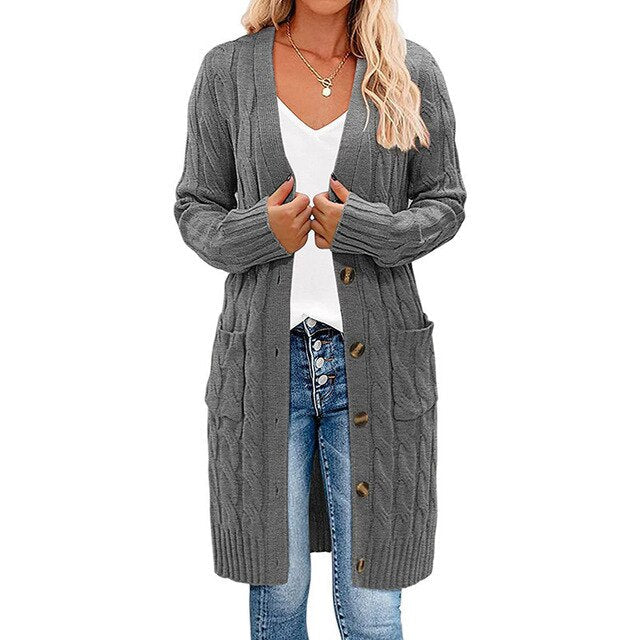 Uniek gedraaid gebreid patroon op dit lange damesvest. Voegt textuur en stijl toe aan comfortabele wintermode.