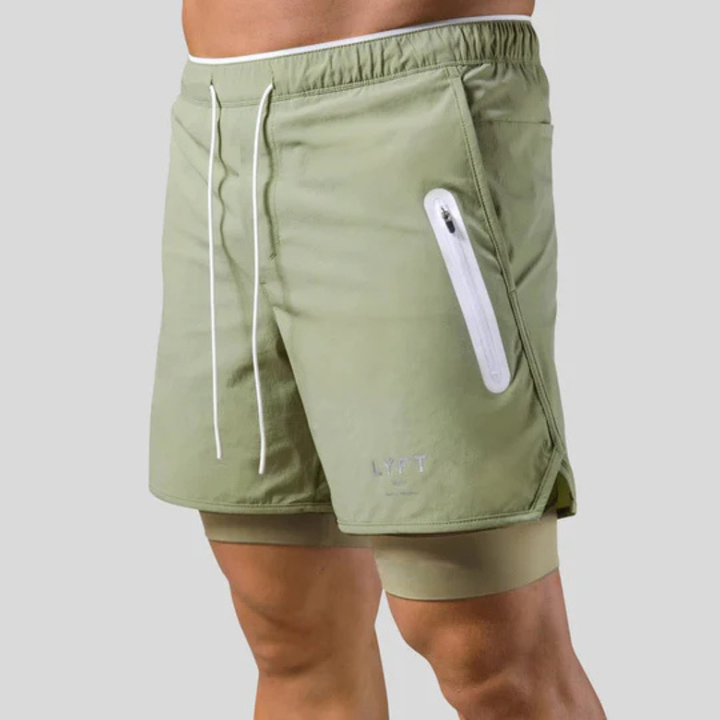Heren trainingsbroek 2-in-1 met compressie voor optimale spierondersteuning tijdens gym en fitness.