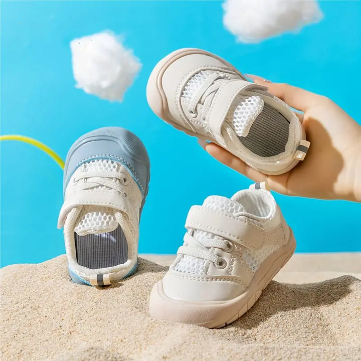 Blauwe FlexiToes baby barefoot sneakers, ideaal voor gezonde voetontwikkeling en eerste stapjes.