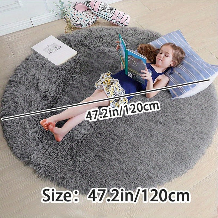 Rond fluffy tapijt Clouda: antislip en wasbaar, ideaal voor speelse kinderkamers.