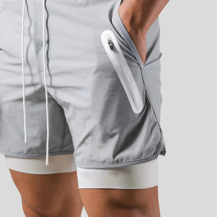 Veelzijdige heren 2-in-1 sportbroek, geschikt als hardloopbroek, gymbroek en trainingsbroek.
