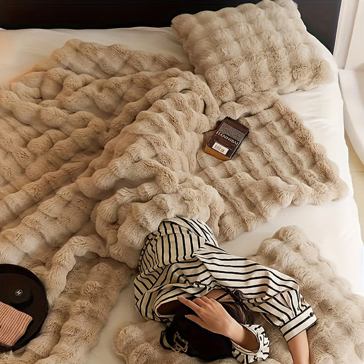Stijlvolle fleece deken als huisdecoratie, voegt warmte en gezelligheid toe aan elk interieur.