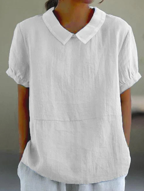 Modieuze effen dames top, veelzijdig te combineren voor een casual of stijlvolle look. Ideaal voor de zomer.