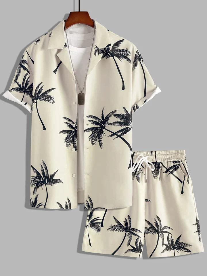 Modieuze heren zomerset met frisse palmprint. Tweedelig, ideaal voor een relaxte en stijlvolle look.