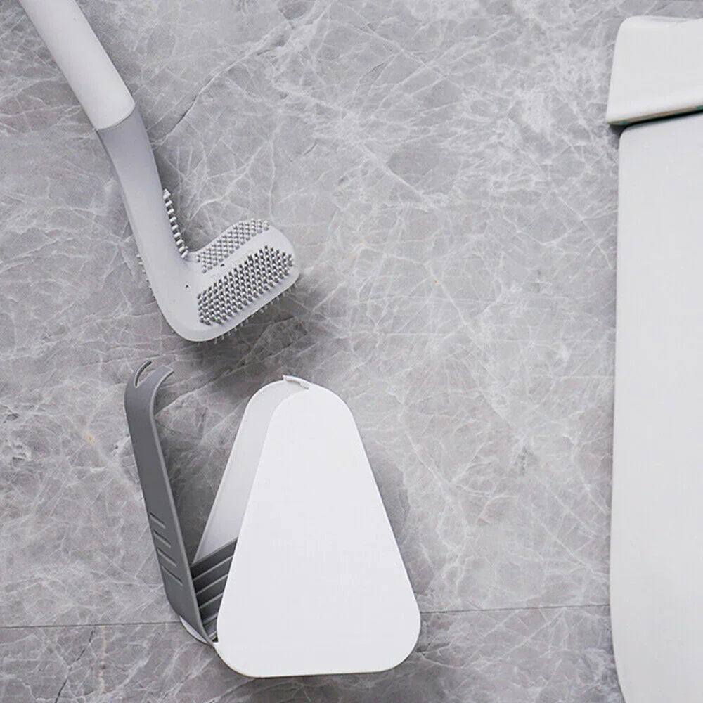 De SmartBrush in zijn compacte houder, boorvrij aan de muur gemonteerd voor een opgeruimd en hygiënisch toilet.