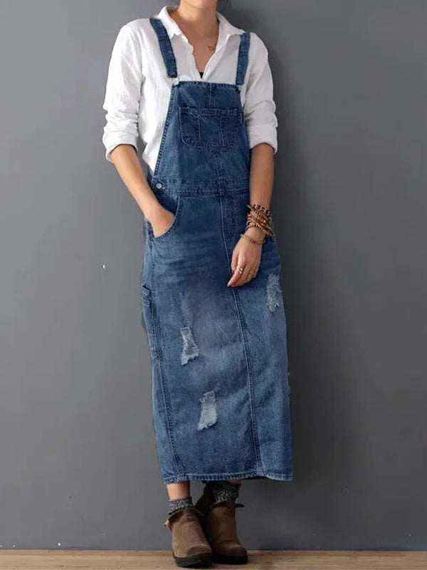 Dames denim dungaree jurk: comfortabele stof, verstelbare bandjes en unieke rugsplit voor een casual look.