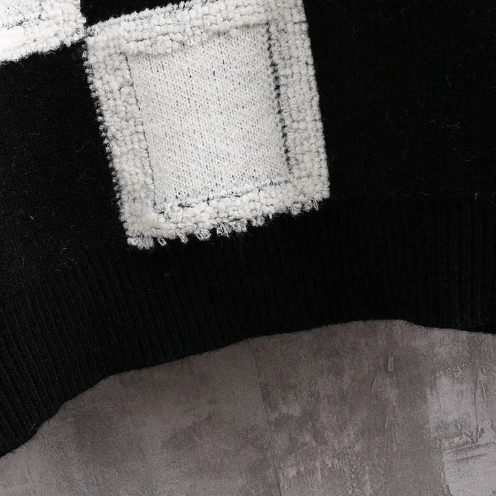 Klassieke geruite herentrui, warm en stijlvol. Perfect voor winterse mode en comfort.
