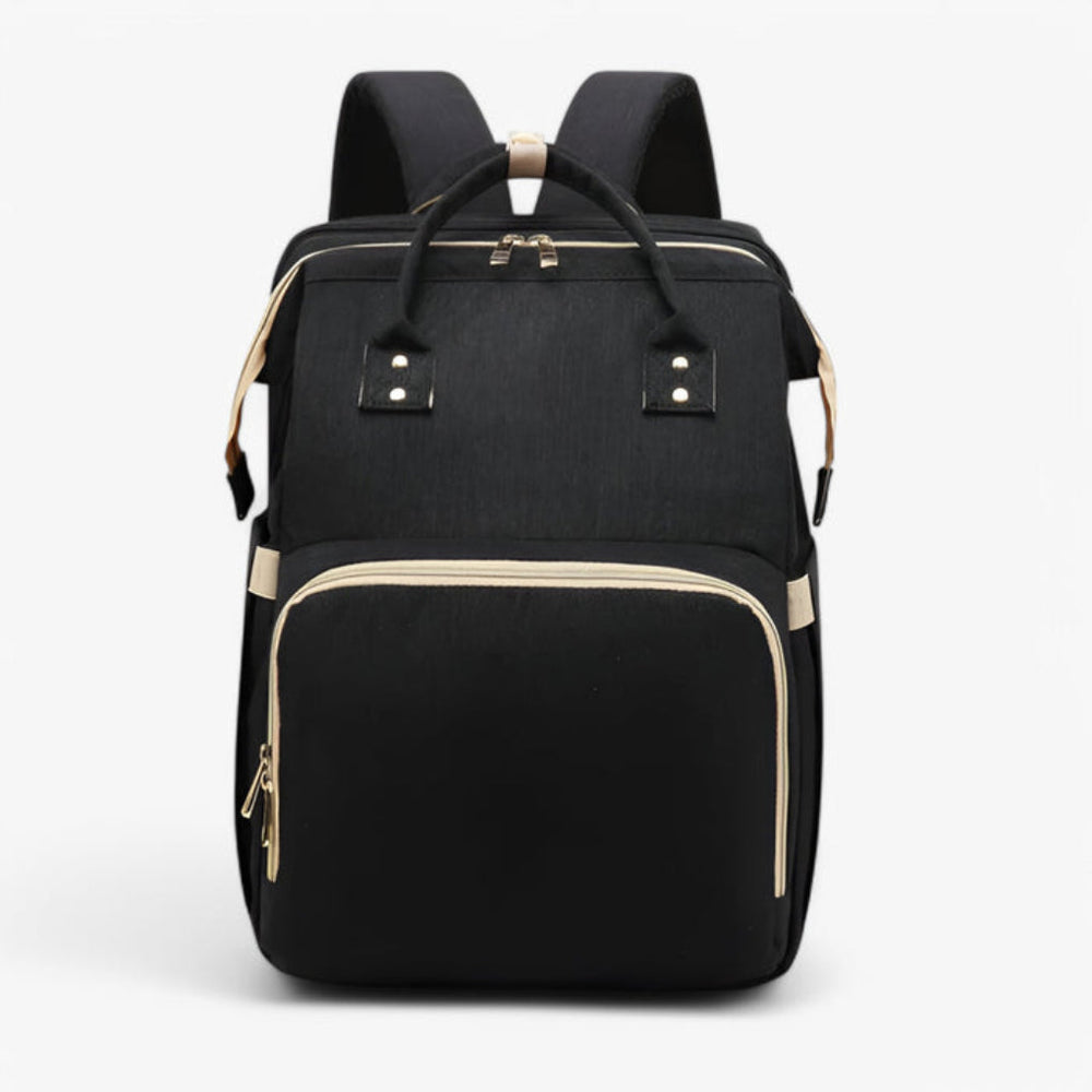 Comfortabel babybedje geïntegreerd in waterafstotende luiertas, perfect voor dutjes tijdens reizen.