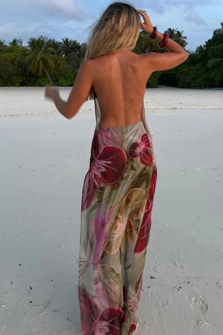 Casual-chique dames maxi-jurk met dunne bandjes, beige tint en zomerse bloemenprint, voor elegantie op vakantie.