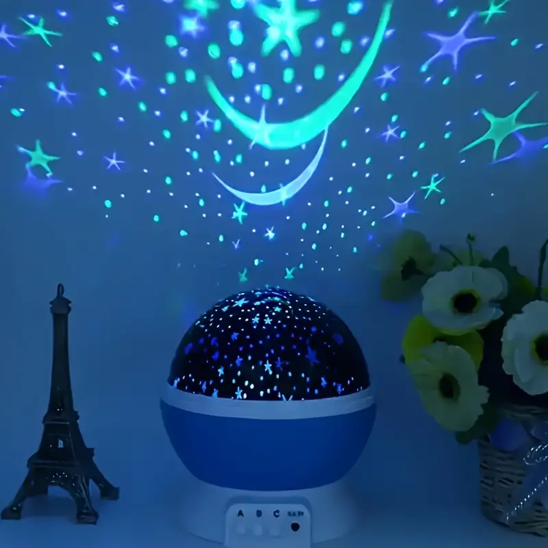 Roze sterrenprojector nachtlampje voor babykamer, projecteert kleurrijke sterren en manen op plafond.