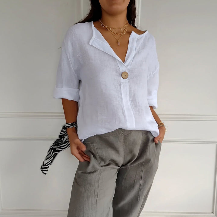 Modieuze abrikoos dames top met V-hals en lange mouwen, stijlvolle blouse met losse pasvorm voor dagelijks gebruik.