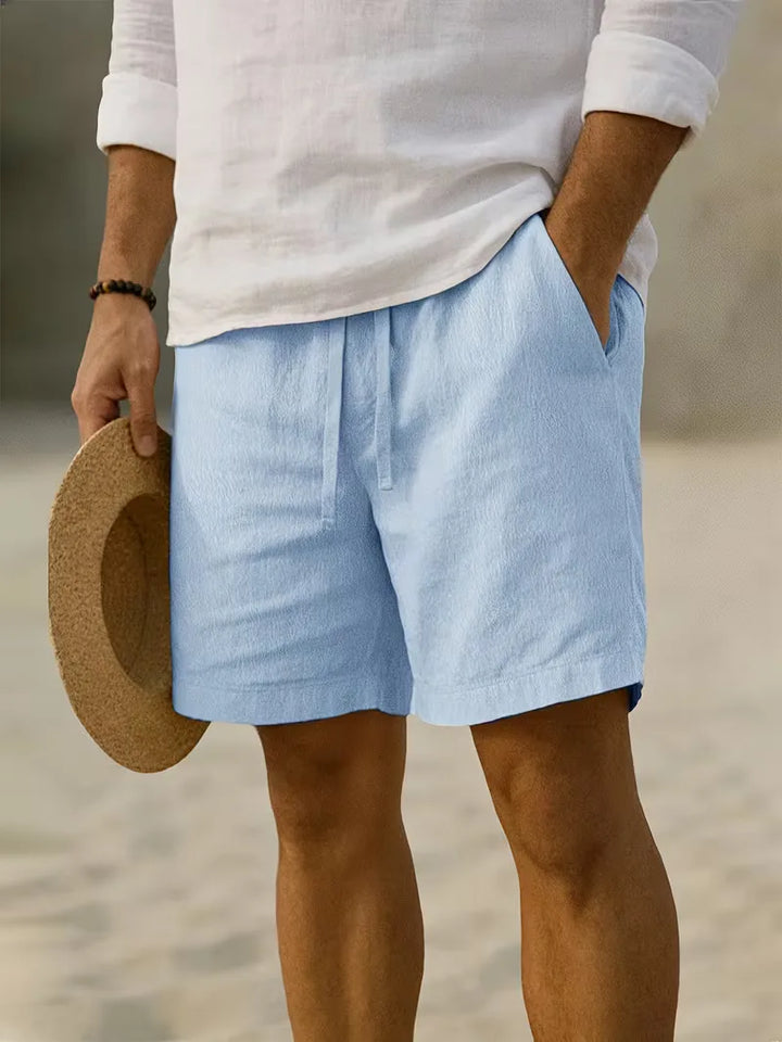 Beige heren plissé shorts, met elastische tailleband voor optimale bewegingsvrijheid.