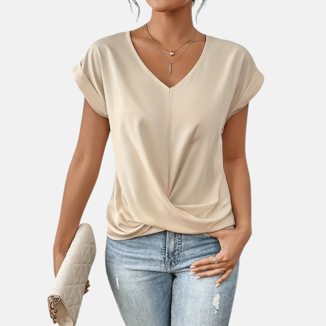 Dames V-hals blouse met gedrapeerde zoom, korte mouwen en effen kleur. Comfortabele en elegante lente/zomer top.