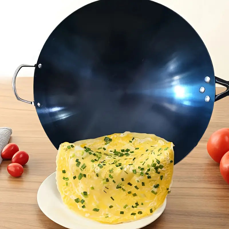Duurzame anti-aanbak wokpan van ijzer, ideaal voor energiezuinig en gezond Aziatisch koken.