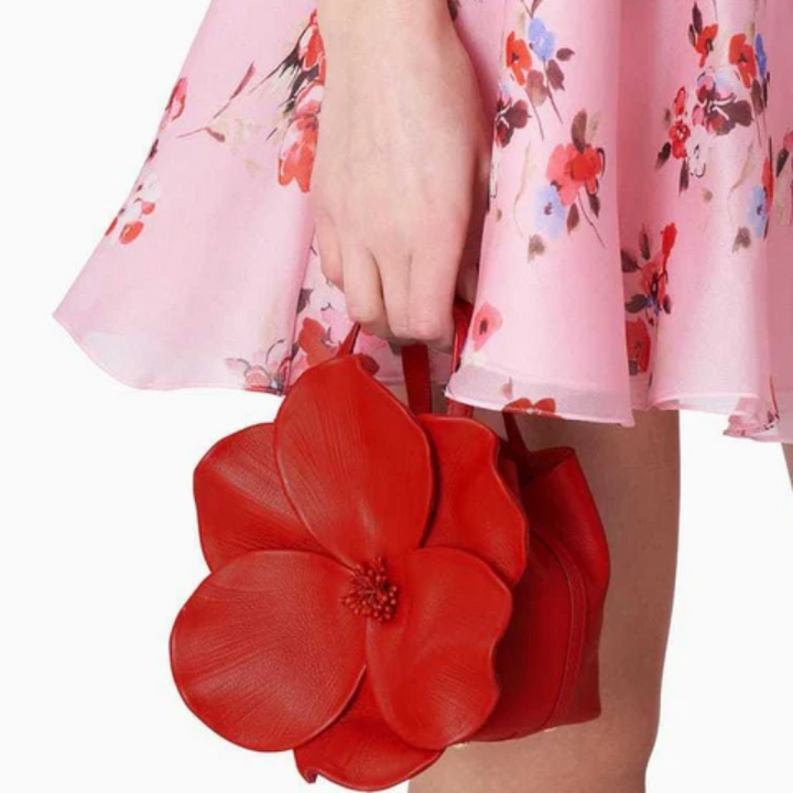 Zwarte mini handtas voor dames met elegant bloemenpatroon, een compacte en trendy schoudertas.