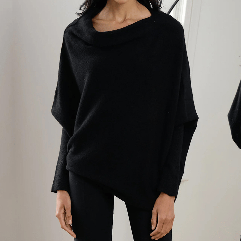 Model toont de elegante pasvorm van de off shoulder damestop.