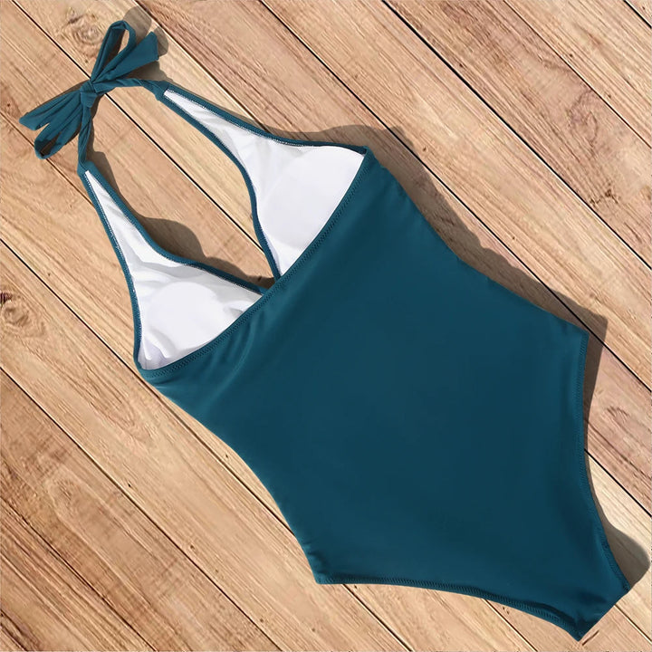 Een stijlvol zwart push-up badpak met open rug, trendy voor zomer en strand.