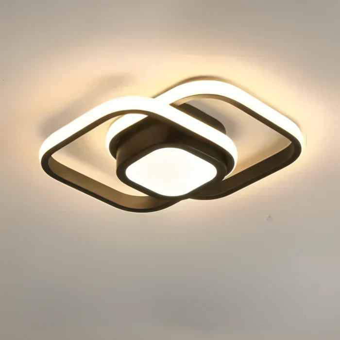 'Twilight Rings' LED plafondlamp, gemonteerd aan plafond. Geeft helder, warm wit en energiezuinig licht.