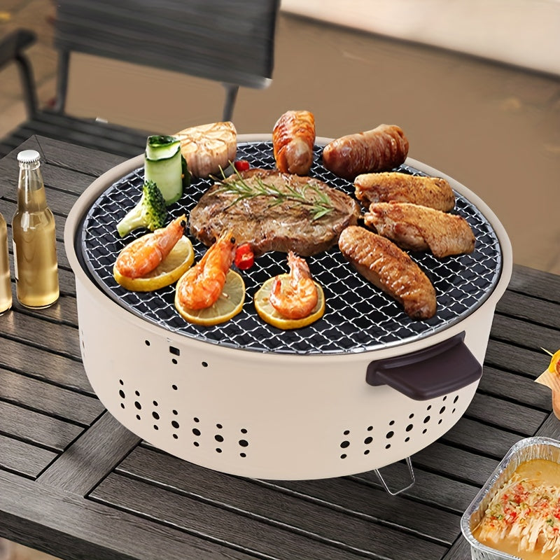 Compacte opvouwbare RVS houtskoolbarbecue voor kamperen en picknicken, makkelijk mee te nemen.