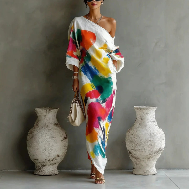 Trendy dames off-shoulder jurk met graffiti print voor een relaxte zomer. Perfect als casual strand- of vrijetijdskleding.