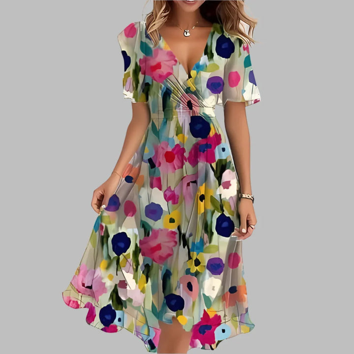 Elegante satijnen dames midi-jurk met bloemenprint, geplooid detail en pofmouwen, ideaal als feestjurk.