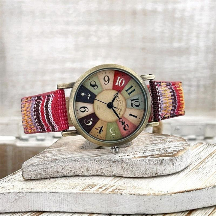 Trendy dames polshorloge met regenboog wijzerplaat en zachte gevlochten band, ideaal voor elke outfit.