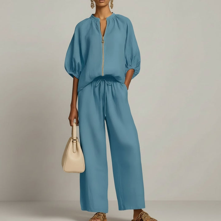 Stijlvolle dames broekset met wijde pijpen en trendy top met rits, comfortabel en modieus voor dameskleding.