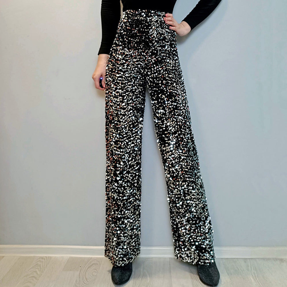 Feestklaar: dames glitterbroek met wijde pijpen, perfecte mix van stijl, glamour en comfort voor speciale avonden.