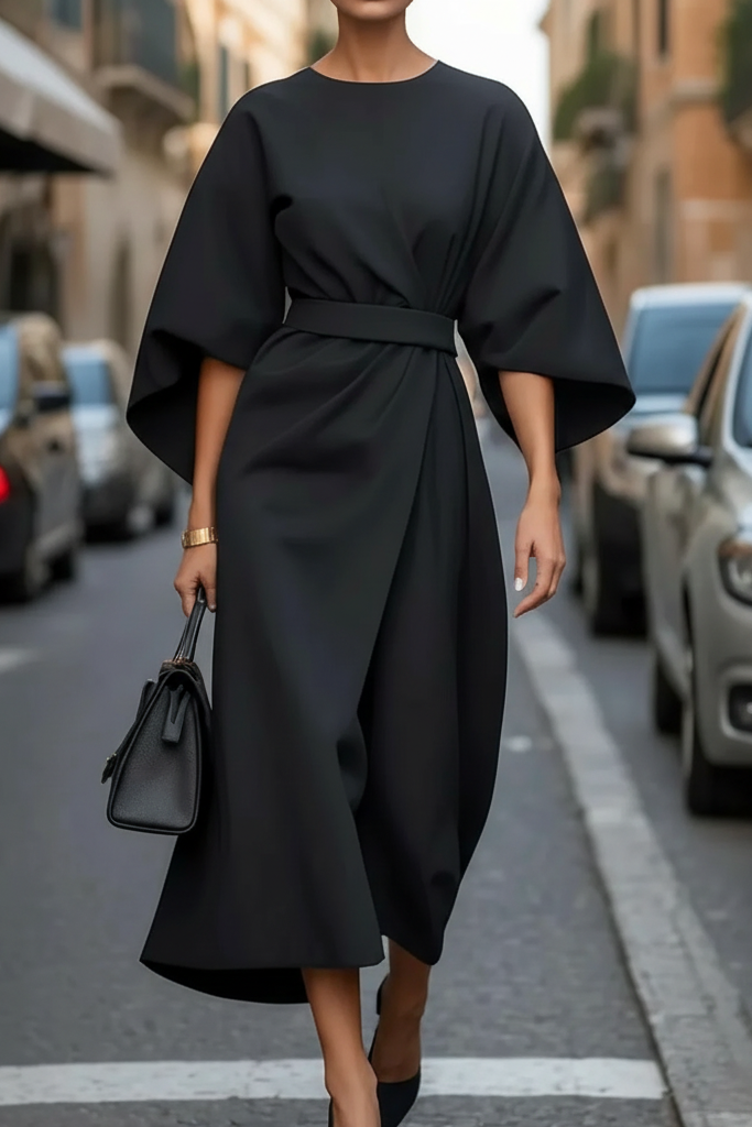 Chique midi-jurk dames in jade met opvallende lampionmouwen en accentuerend tailleceintuur.