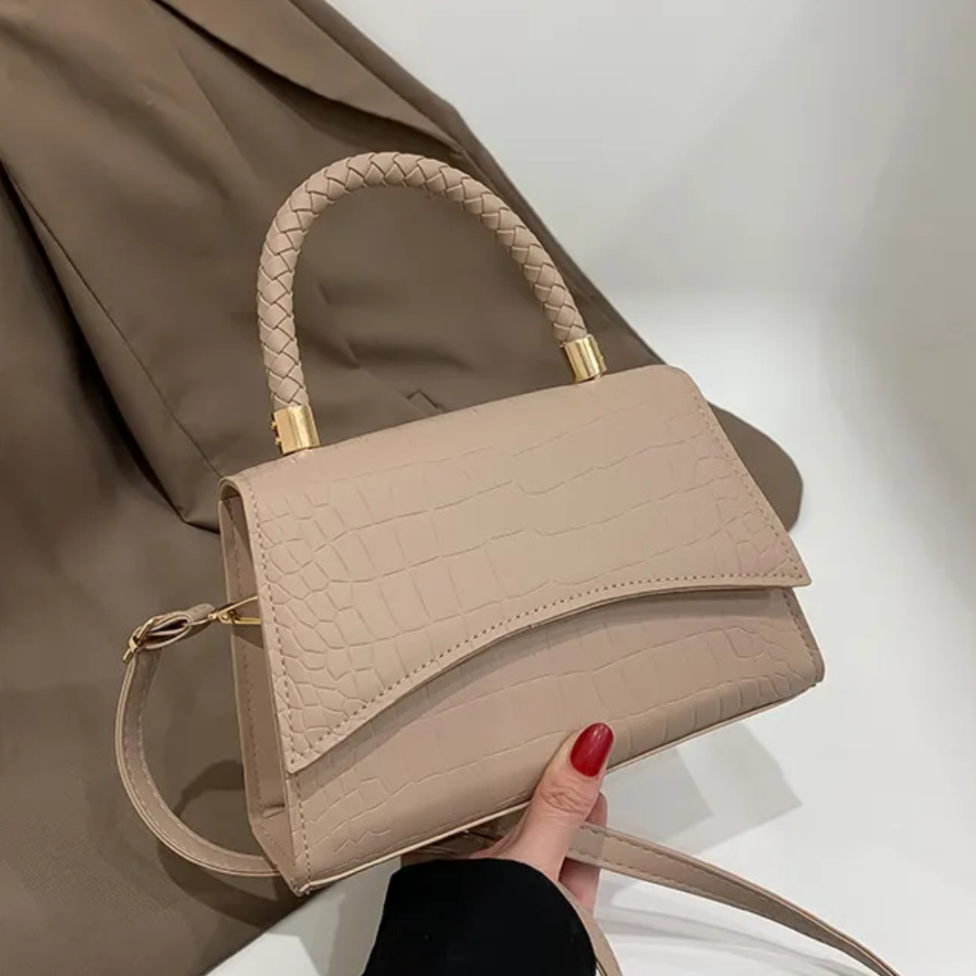 Zwarte dames handtas van PU leer met handvat en verstelbare schouderriem. Stijlvolle crossbody tas.