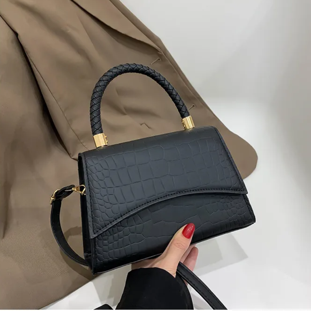 Dames handtas van PU leer met bovenhandvat & verstelbare crossbodyband. Elegant mode accessoire.