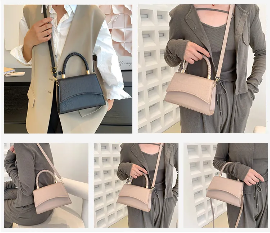 Dames draagt een elegante zwarte PU leren handtas als schoudertas, perfect voor dagelijks gebruik.