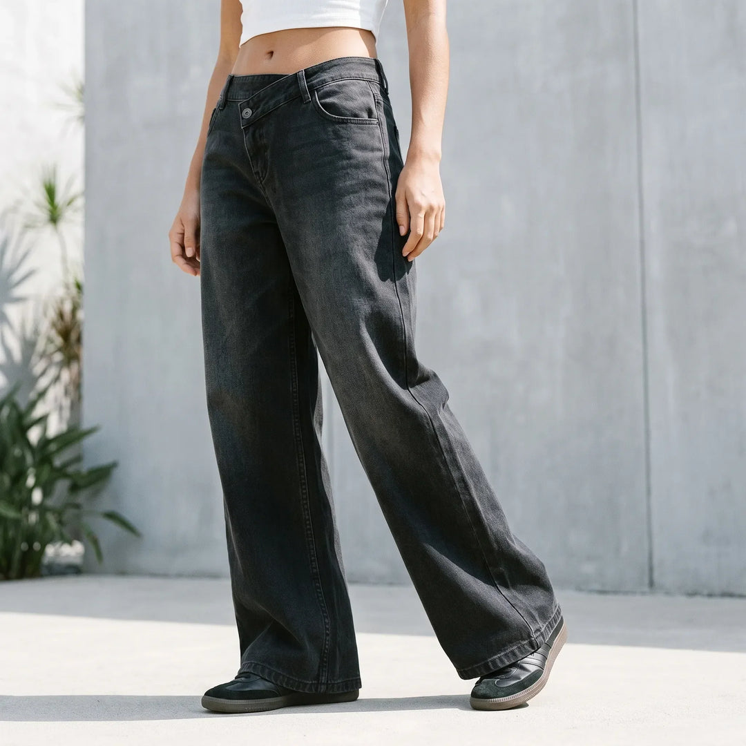 Dames wijde jeans met hoge taille en unieke asymmetrische knoopsluiting; comfortabele modieuze spijkerbroek.