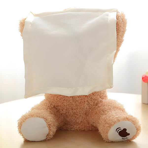 Bruine zingende kiekeboe knuffelbeer, leuk en zacht speelgoed voor baby's en peuters.