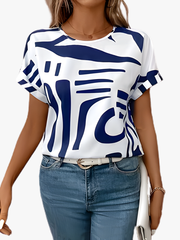 Wit dames T-shirt met korte mouwen en stijlvolle abstracte print, perfect voor een casual zomerlook.