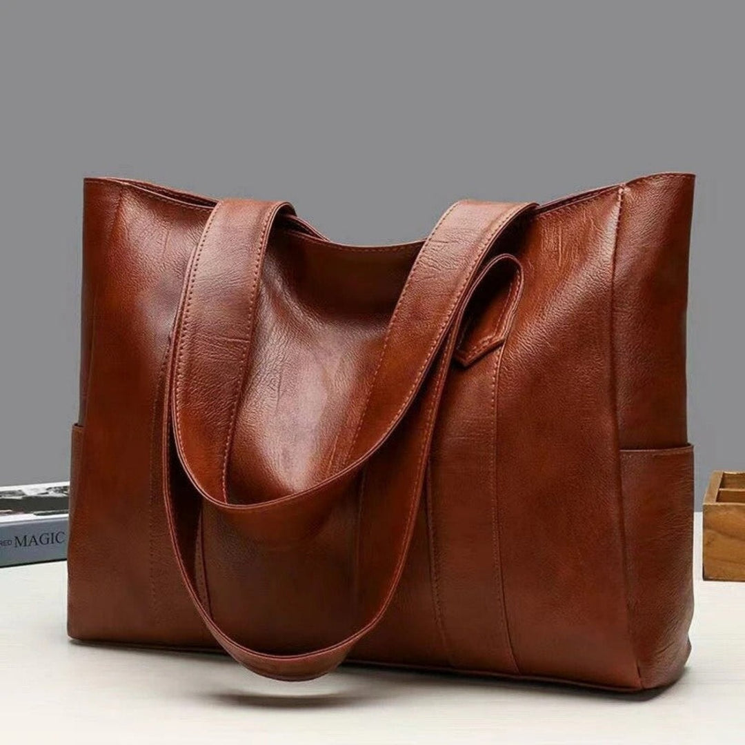 Elegante dames handtas/schoudertas in vintage bruin, perfect voor modebewuste vrouwen, praktisch en stijlvol.