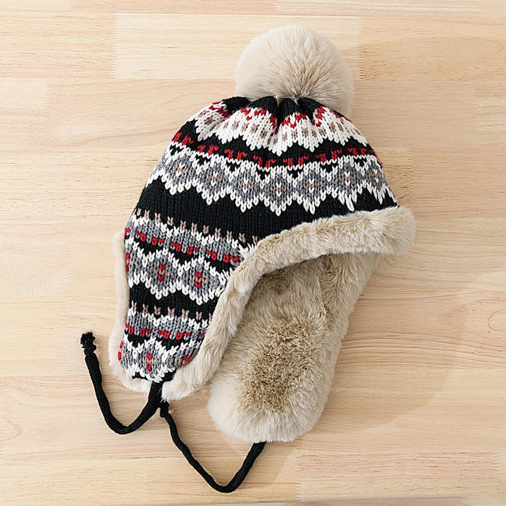 Warme pilotenmuts met opvallende oorflappen, gevoerd met imitatiebont voor extra warmte.