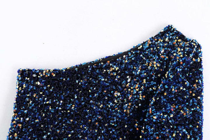 Feestelijke dames top met sprankelende glitter en unieke one-shoulder pasvorm.