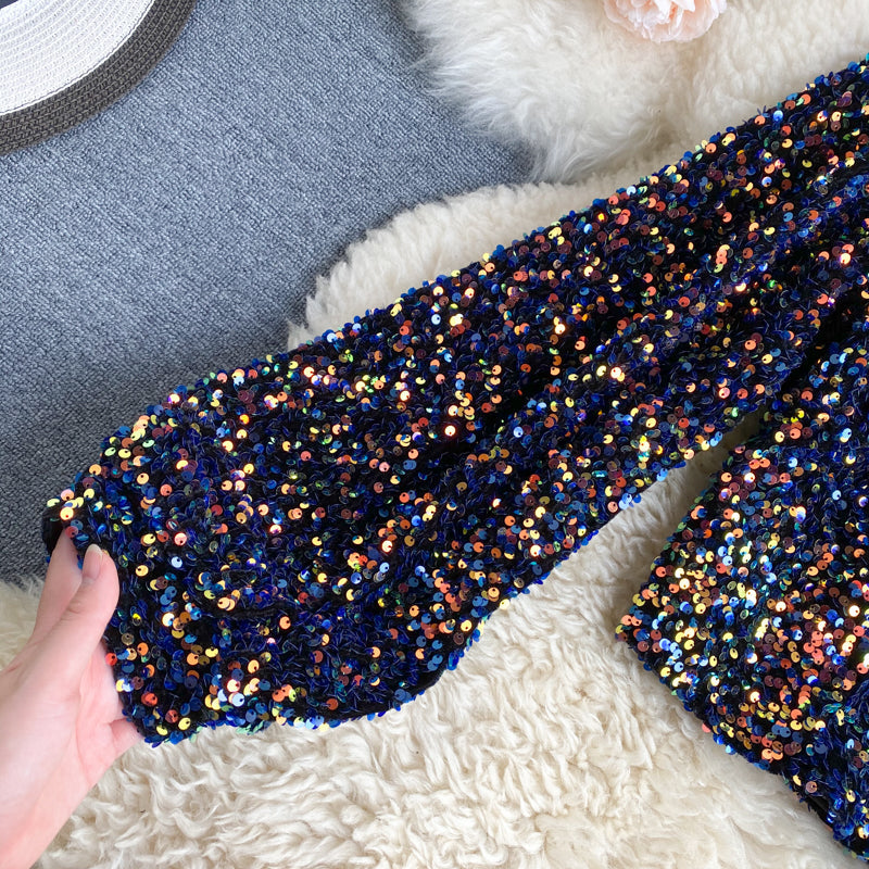 Elegante dames one-shoulder top met glitters en pailletten voor een glamoureuze uitstraling.