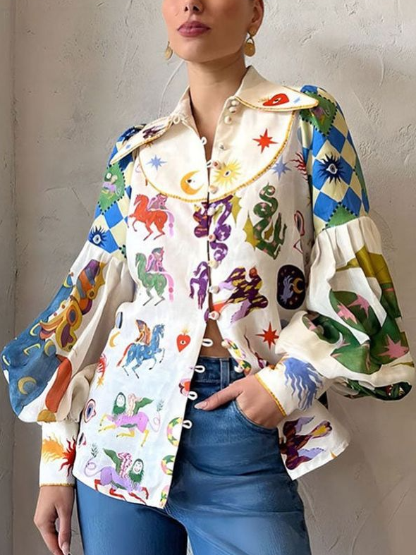 Trendy dames blouse met unieke pop-art print en charmante pofmouwen, een opvallend fashion item.