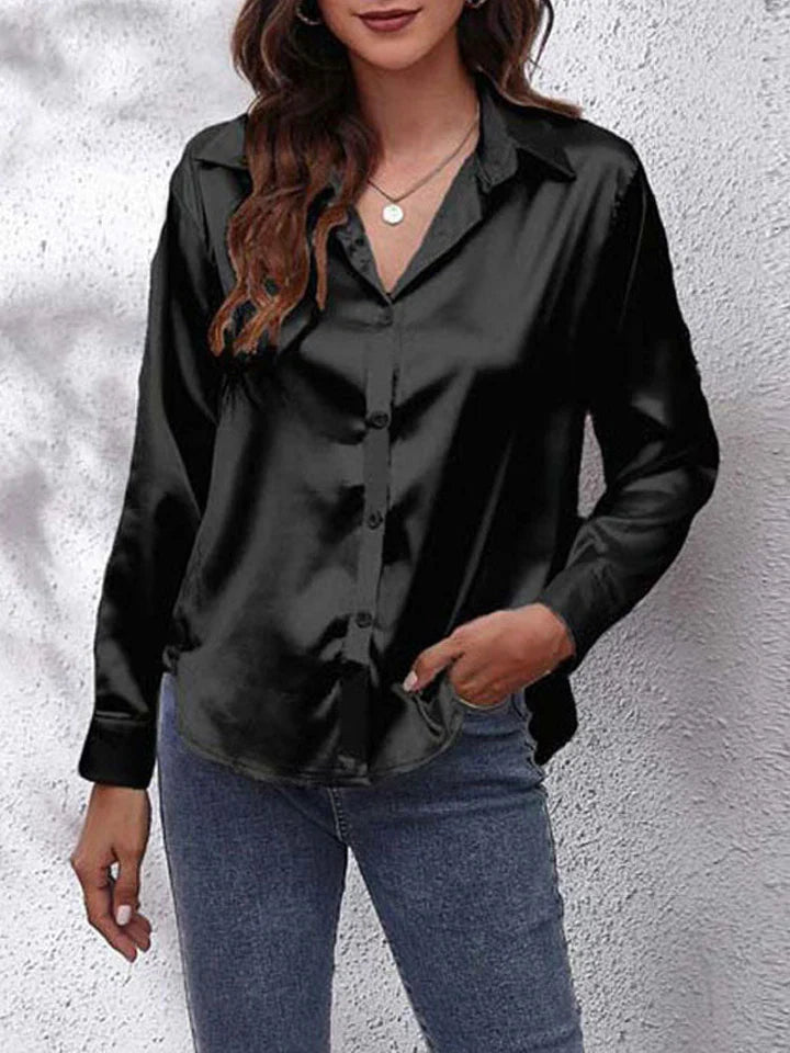 Comfortabele damesblouse met elegante glans, lange mouwen; perfecte chique top voor vrouwen.