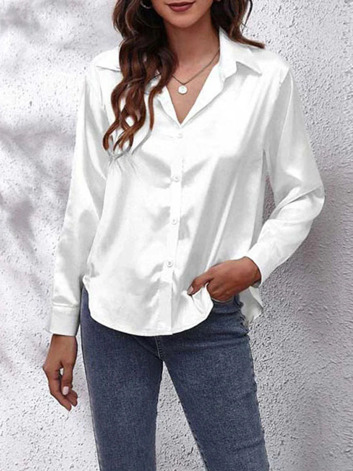 Stijlvolle damesblouse met subtiele glans en lange mouwen, ideaal voor kantoor- en partylooks.