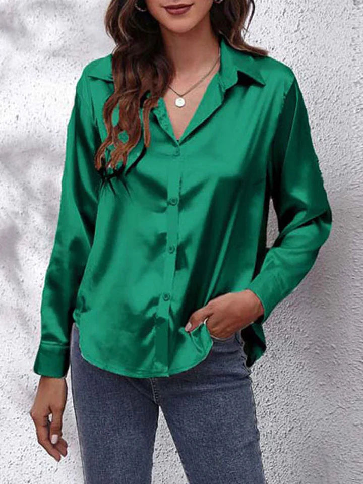 Elegante damesblouse met glans en lange mouwen; stijlvolle top voor kantoor en party.