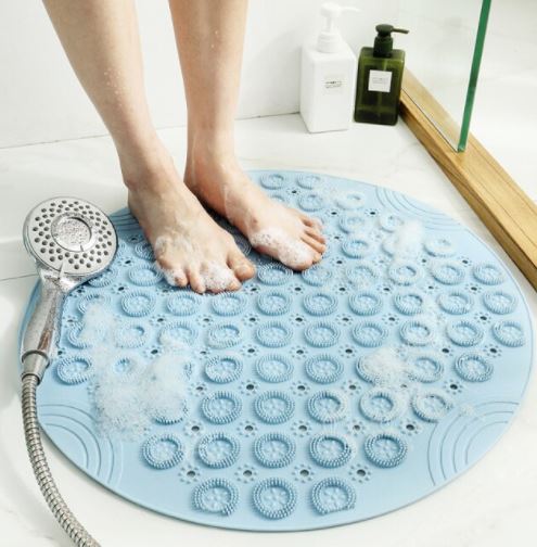 Witte anti-slip badmat met reliëf voor massage en extra grip, voor een veilige douche-ervaring.