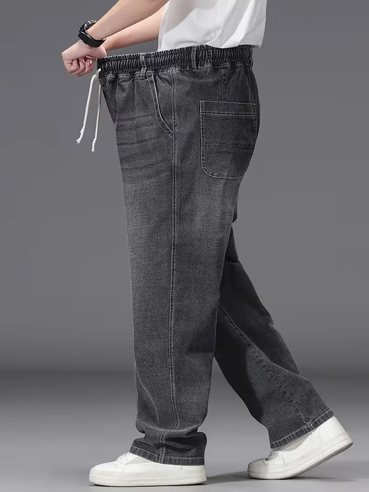 Streetwear heren jeans met losse pasvorm, elastische taille en trendy design.