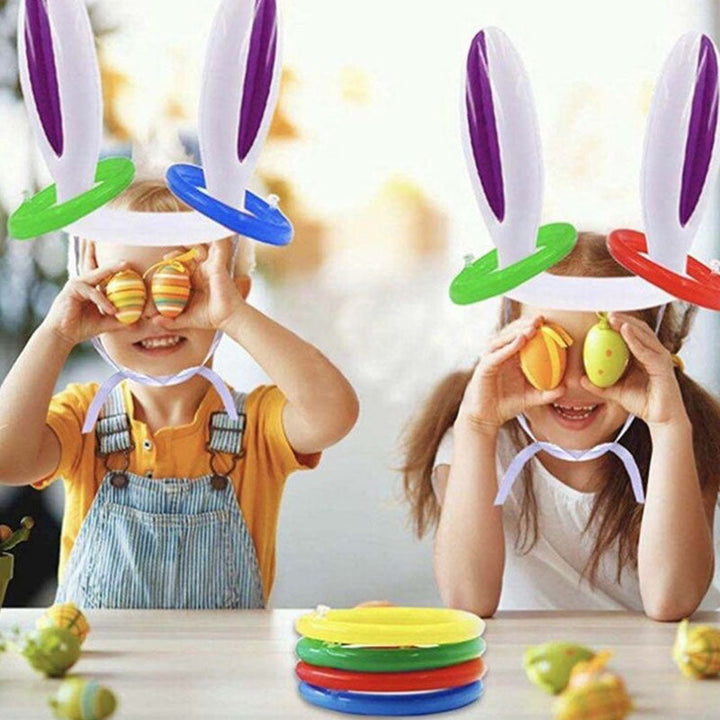 Kinderen genietend van buitenspelen met opblaasbaar konijn werpspel; perfect voor de tuin of park.
