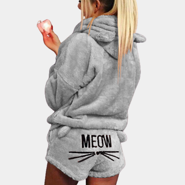 Moderne dames pyjamaset van comfortabel fleece met capuchon; perfect voor een ontspannen en warme avond.