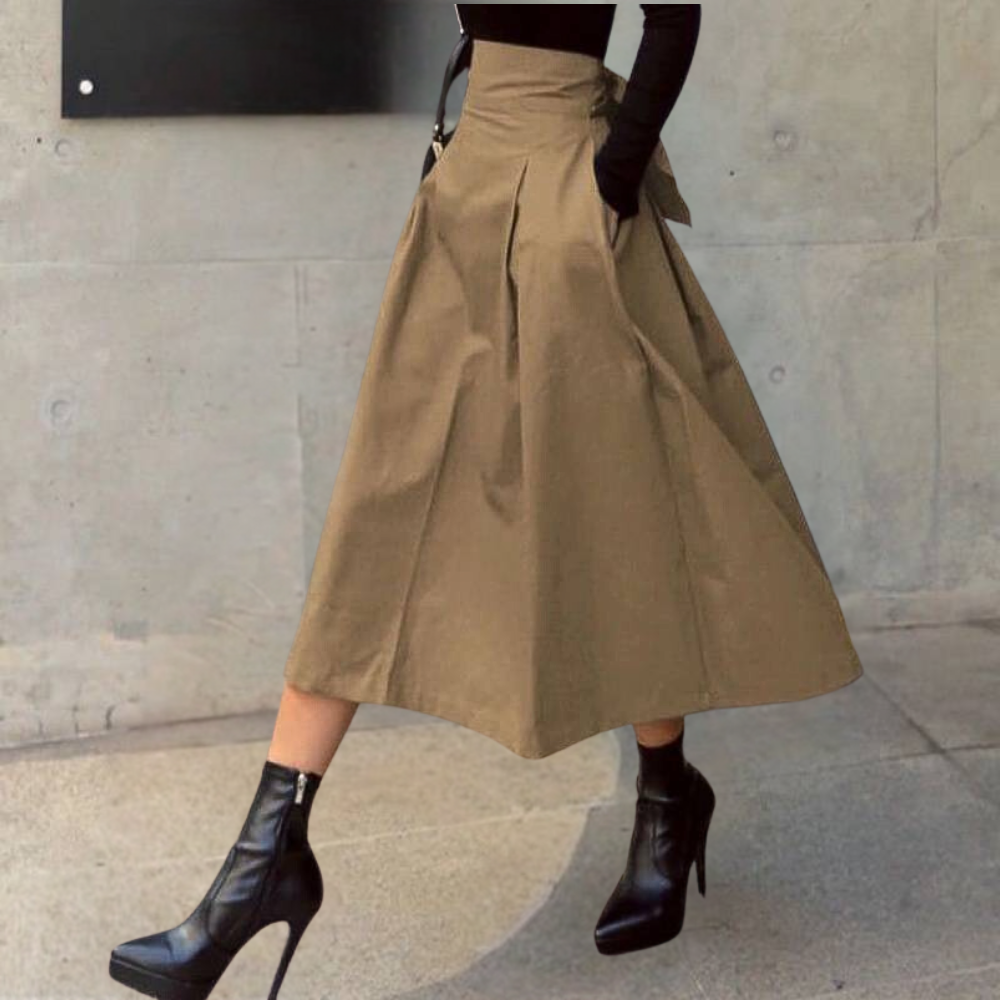 Comfortabele bruine high-waist rok met strikdetail en A-lijn; veelzijdig voor elke modieuze outfit.