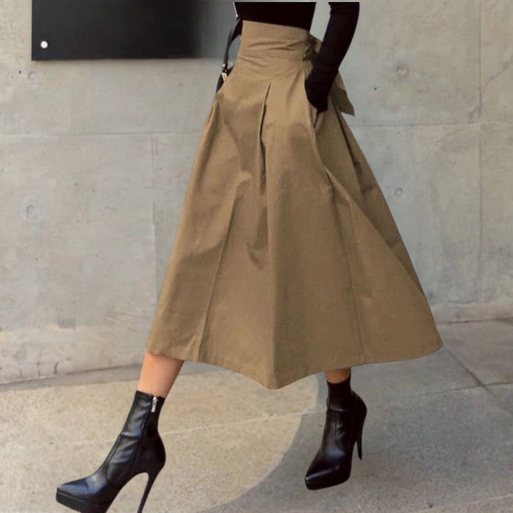 Comfortabele bruine high-waist rok met strikdetail en A-lijn; veelzijdig voor elke modieuze outfit.